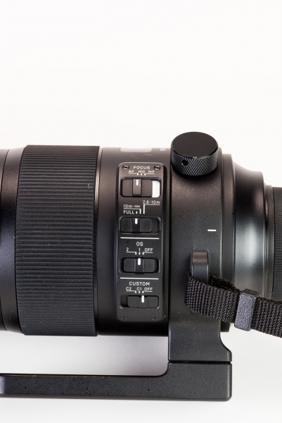 The three primary switches on the lens control (top to bottom): focus mode, focus limiting ranges, and optical stabilizer. The lowest switch selects a custom mode you program with the optional USB Block. 
