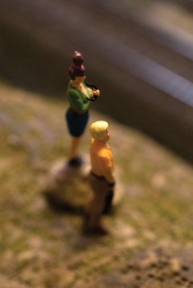 Using the macro capability, I brought the lens in close to capture two miniature figures observing the train environment.