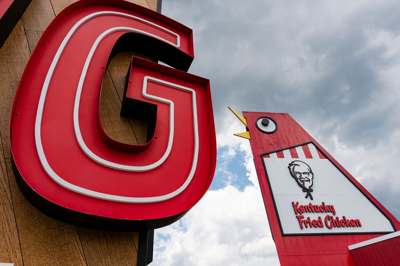 With a wide-angle 16mm lens, the potential distortion of near-far spatial relationships can spur creativity. At f/9 this exposure is crisp on the foreground and the mid-distance signage. 