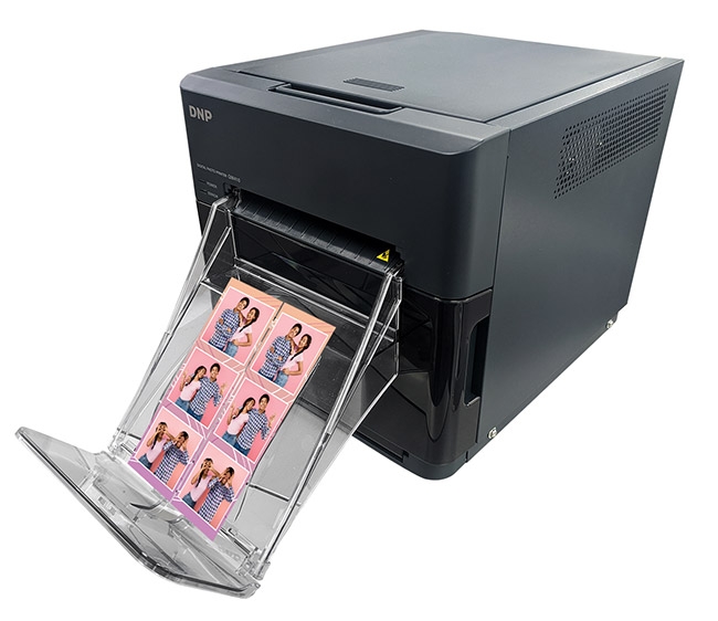 The DNP QW410 Printer with two 2x6-inch prints. 