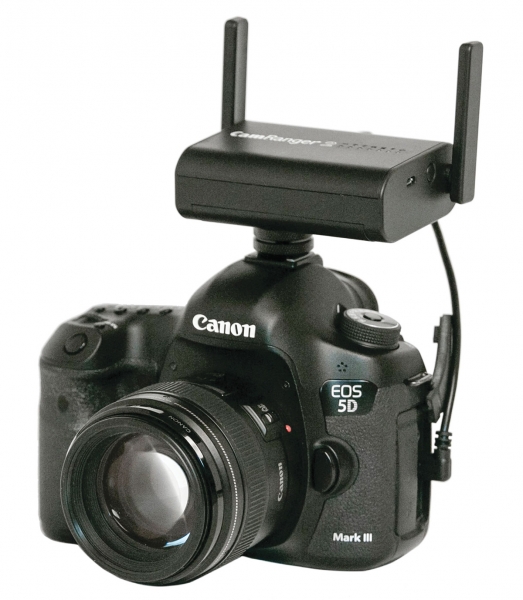 CamRanger 2 mounted on the camera hot shoe with the hot shoe adapter and camera cable, both of which are supplied with the purchase. 