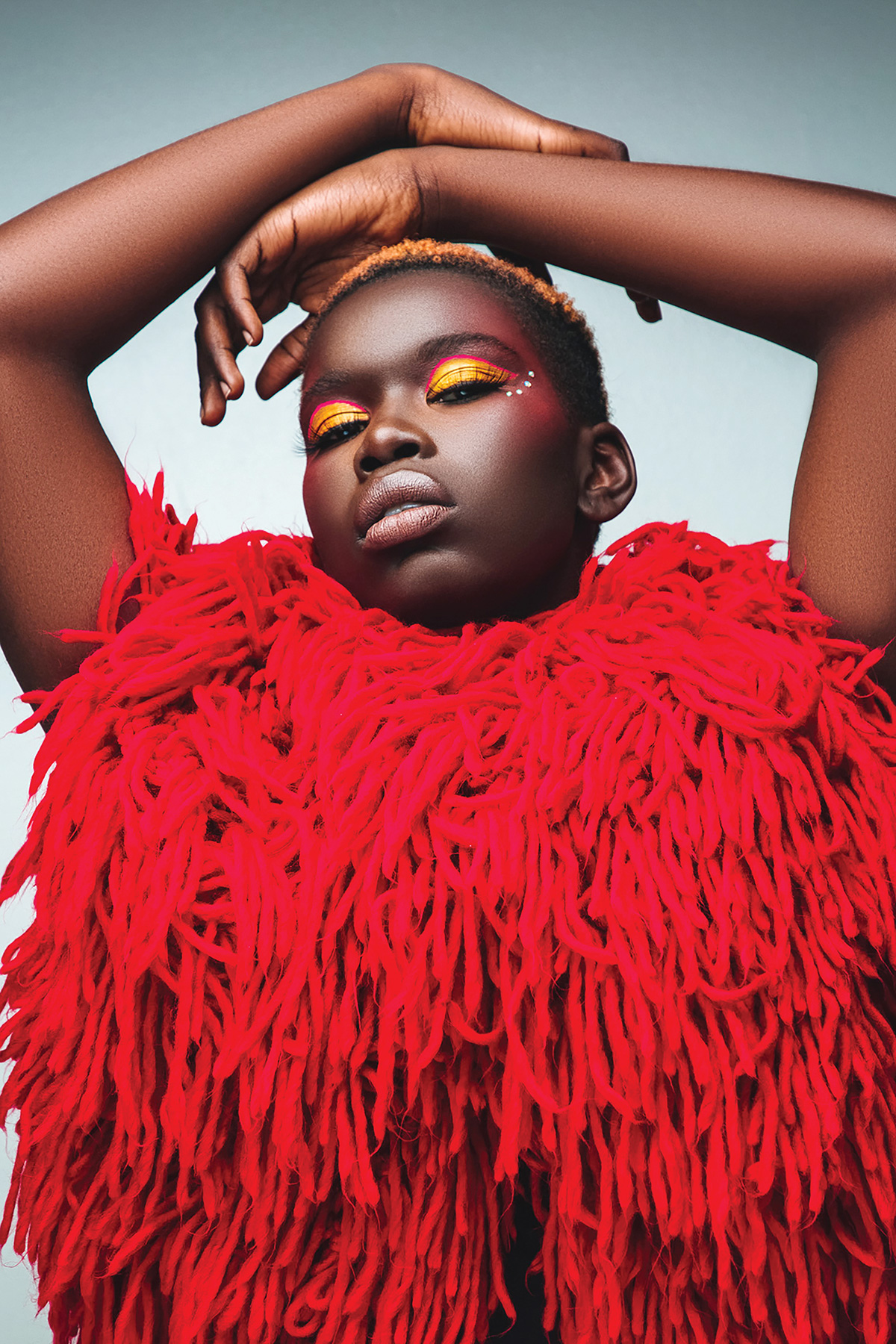 Woman wearing shirt of shaggy red yarn