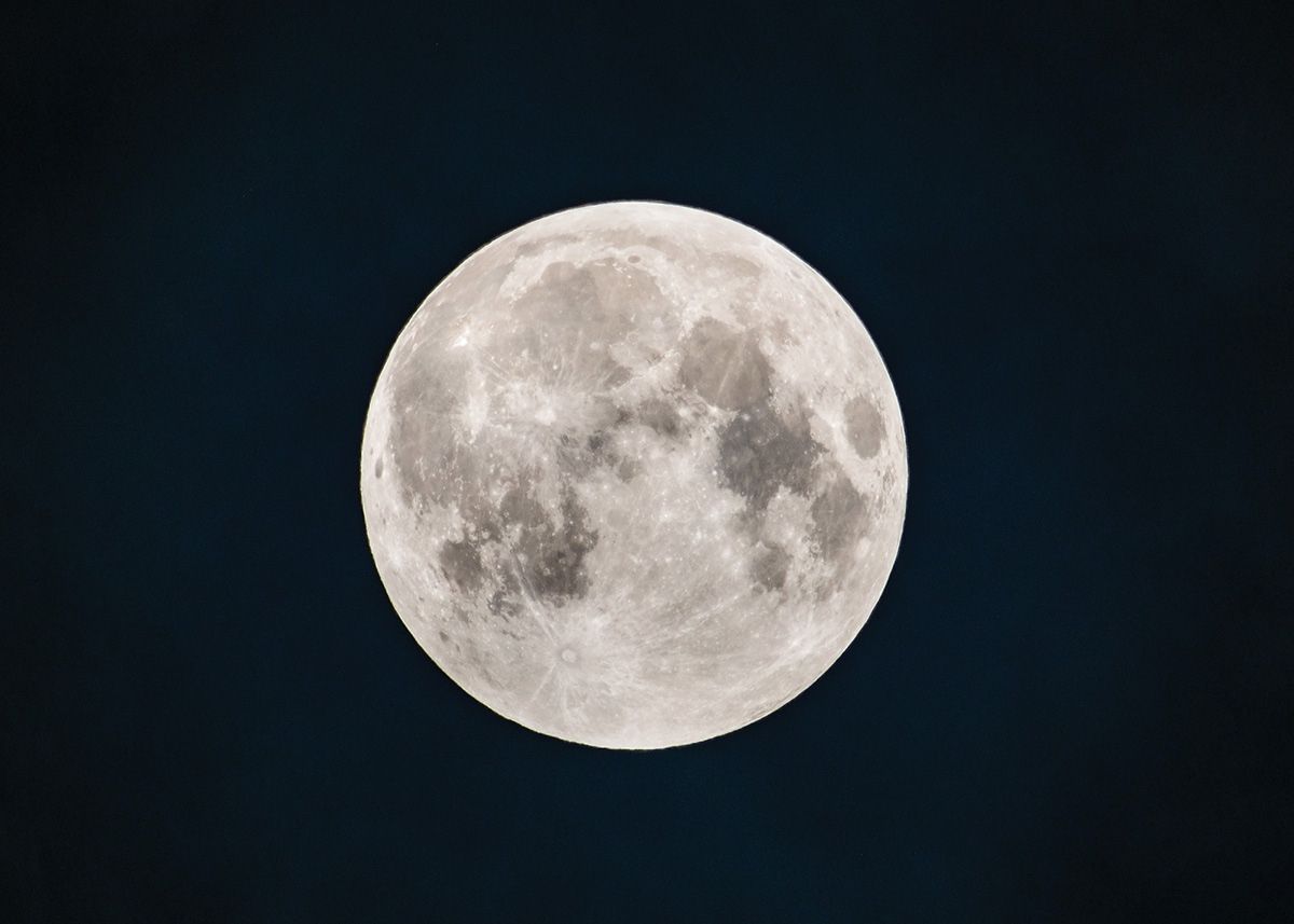 A remote camera release is essential to capture a sharp photo of the moon with a 600mm lens and 1.4x telextender. This image is cropped from the original.